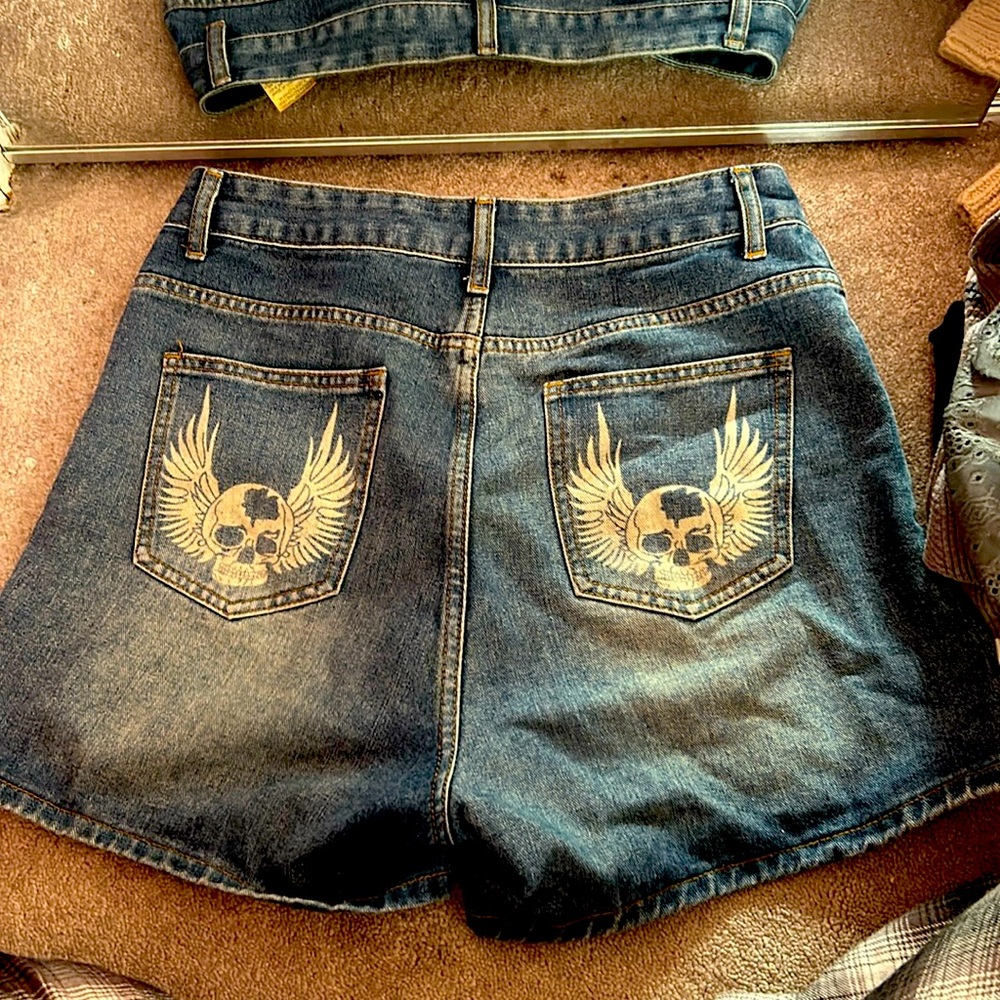 blue was jorts with skulls on the pockets